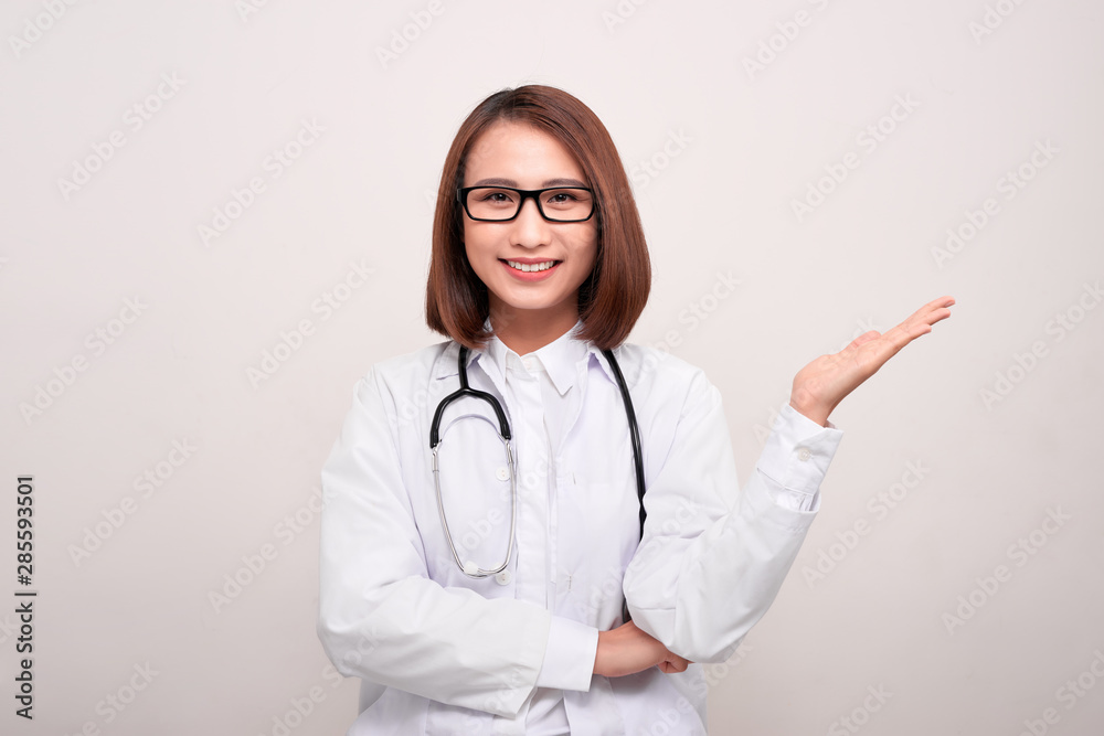 young doctor woman showing copy space isolated on white background young doctor woman showing copy space isolated on white background