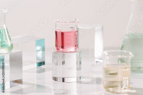 Bottles with different perfume oils on table