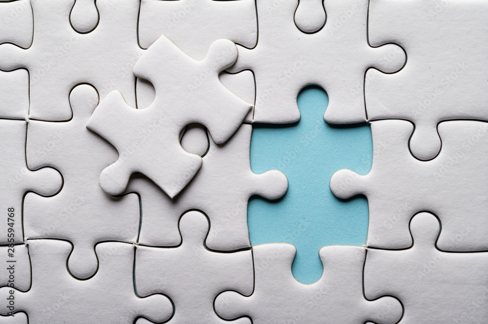 Jigsaw puzzle with missing piece. Missing puzzle pieces Stock Photo