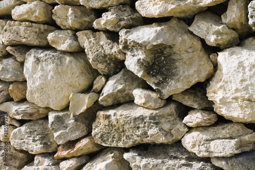 Fragment of a protective wall of yellow Maltese stone.
