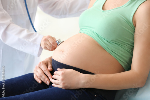 Doctor examining pregnant woman in clinic © Pixel-Shot