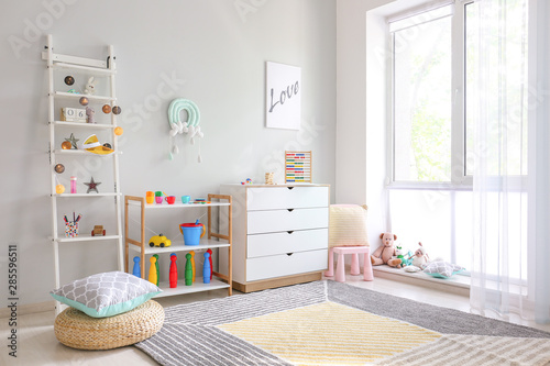 Interior of modern children's room with toys photo