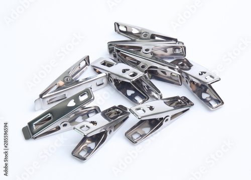 Peg steel, metal clothespin isolated on white background