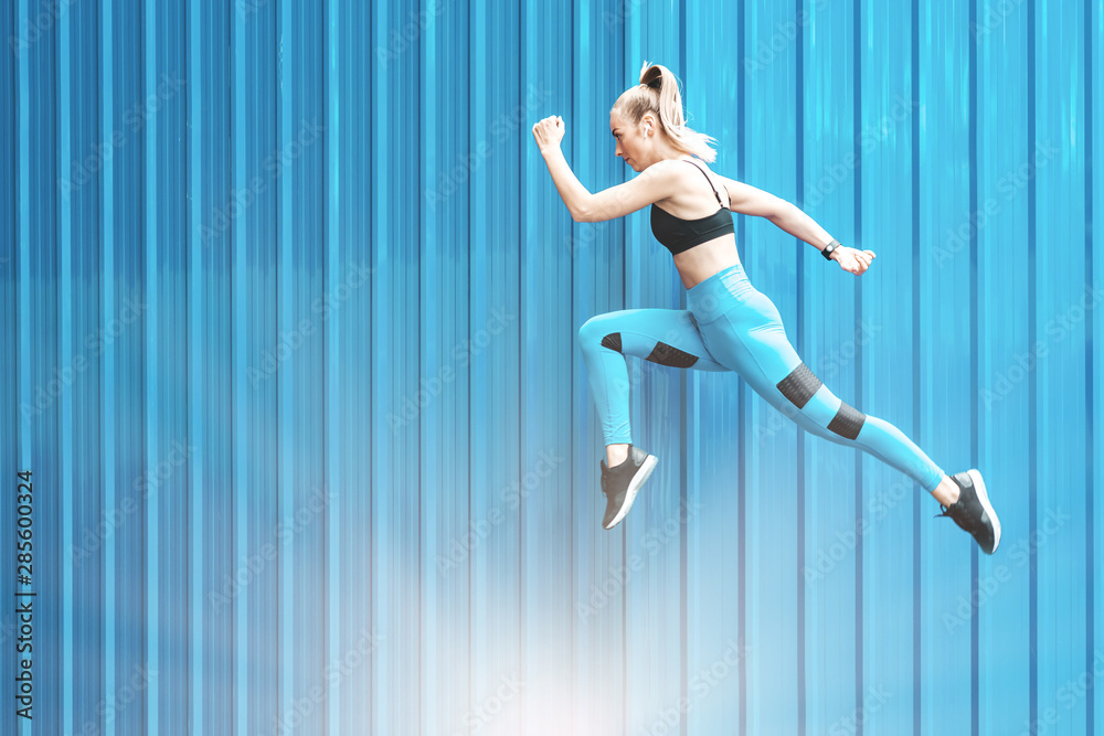 Get a jump on your day! Fitness girl having a work out outdoors. Copy space on the left side Get a jump on your day! Fitness girl having a work out outdoors. Copy space on the left side