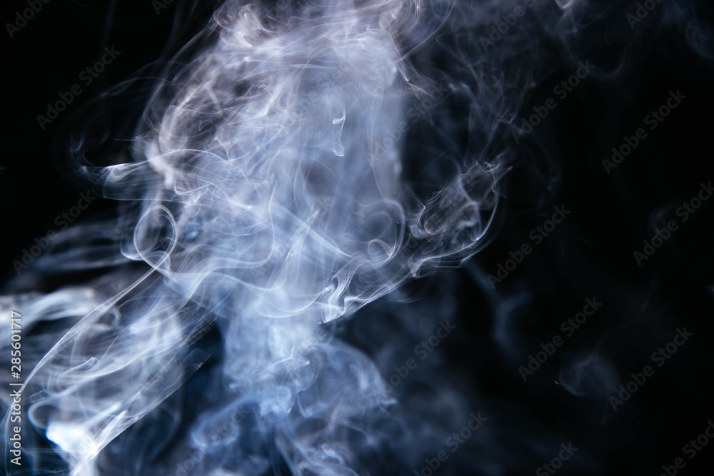 Blue smoke waves on black background