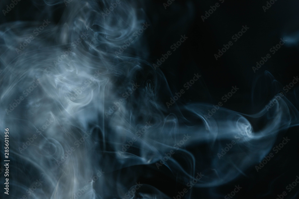Grey smoke waves on black background