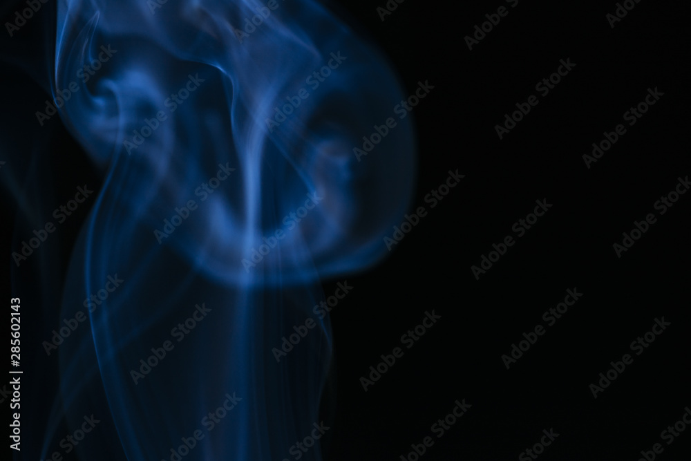 Blue wavy smoke on black background