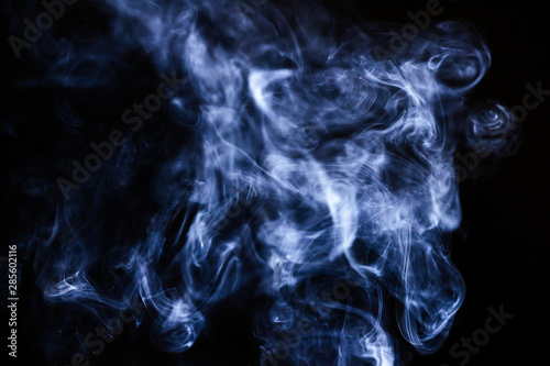 Blue wavy smoke on black background