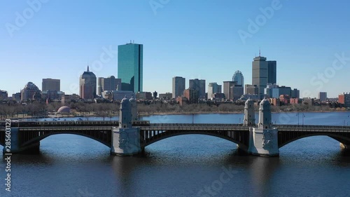 Aerial establishing city skyline of Boston Massachusetts with Longfellow bridge and subway train crossing. photo