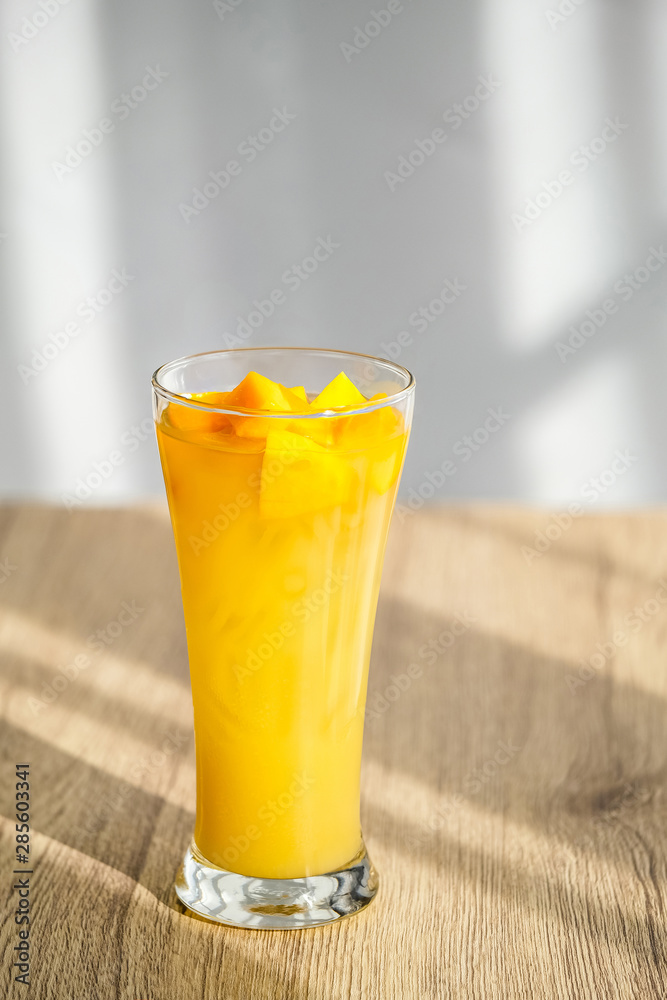 Mango Boba Bubble Milk Tea with bubble topping for tea or other beverage on the wood table with copy-space for textures and wall Natural light background Mango Boba Bubble Milk Tea with bubble topping for tea or other beverage on the wood table with copy-space for textures and wall Natural light background