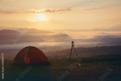 Outdoor camping tent among meadow on mountain during sunset at Yun Lai Viewpoint, Pai town , Mae Hong Son in Thailand. This is very popular for photographers and tourists.