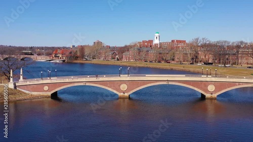 Aerial over the John W. Weeks Footbridge reveals Harvard University campus on the Charles River.