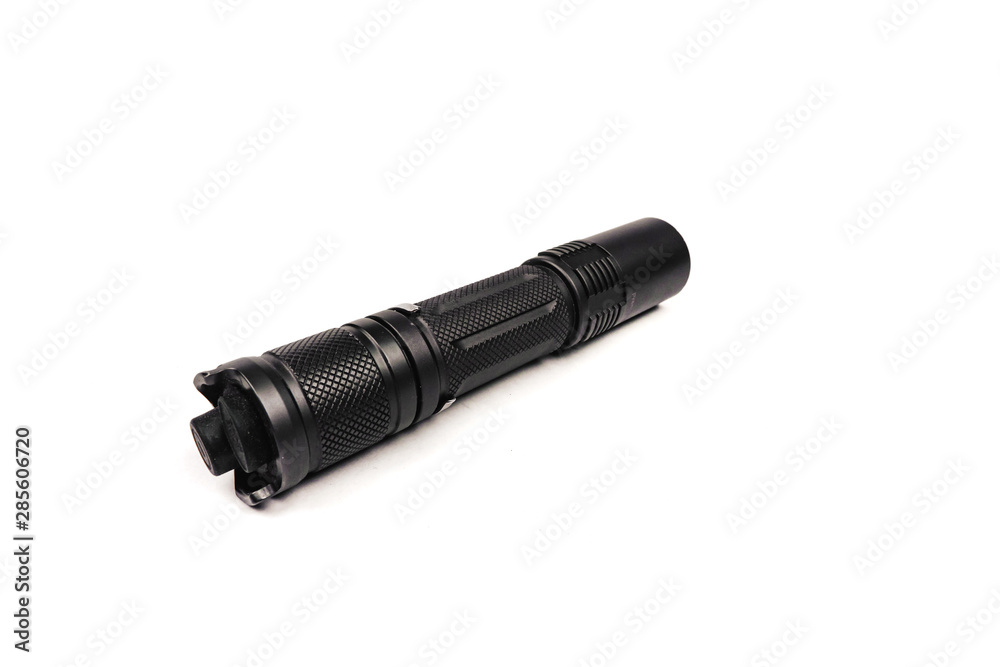 black long flashlight isolated on white background.