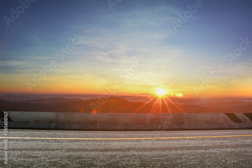 A photo of the road with sunset. landscape in the summer time in Thailand © Kalawin