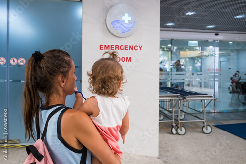 Mom and child come in in the emergency room at the hospital in Pattaya Thailand.