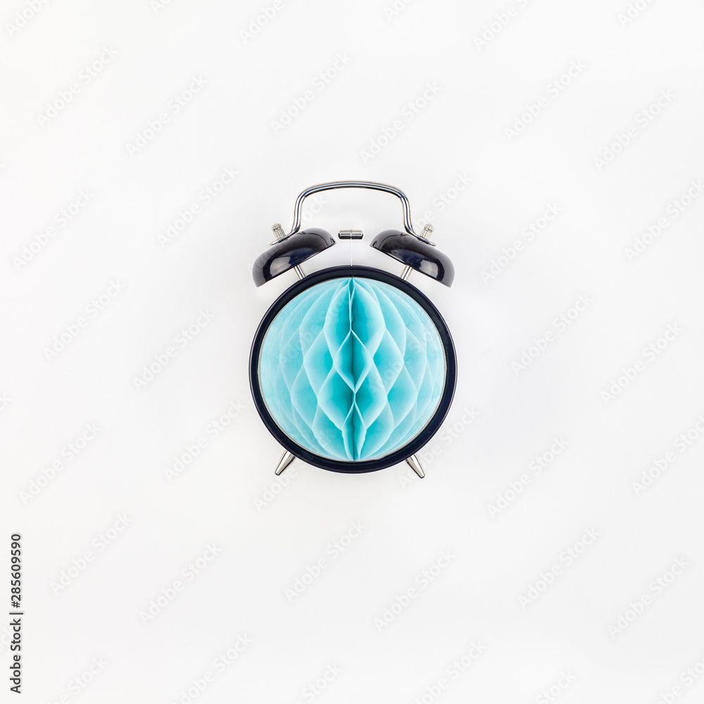 Fototapeta premium Black alarm clock with blue paper ball concept