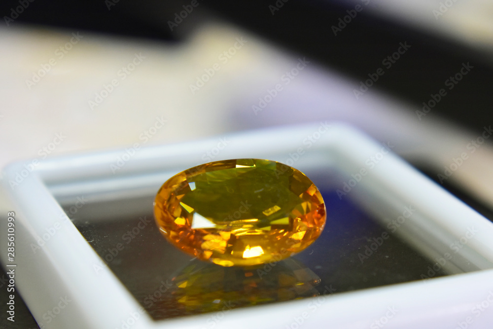 Yellow gemstone is a natural gemstone that has been cut through Is an expensive gem Yellow gemstone is a natural gemstone that has been cut through Is an expensive gem