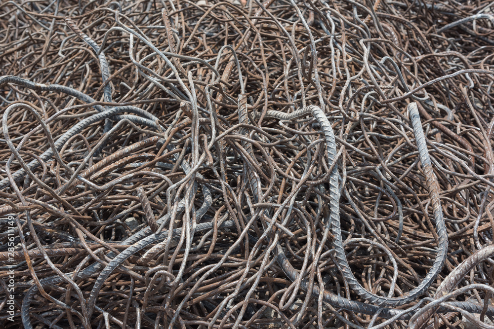 Messy twisted rusty steel building waste closeup Messy twisted rusty steel building waste closeup