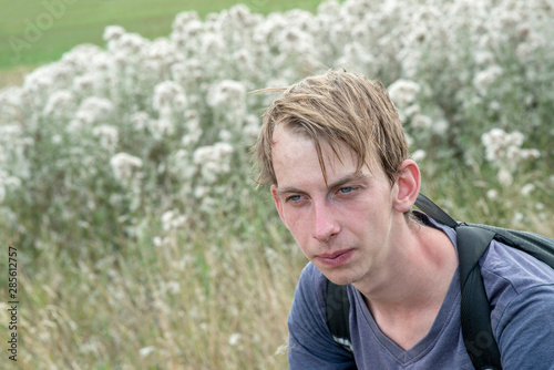 Portrait of young man outdoor in summer.