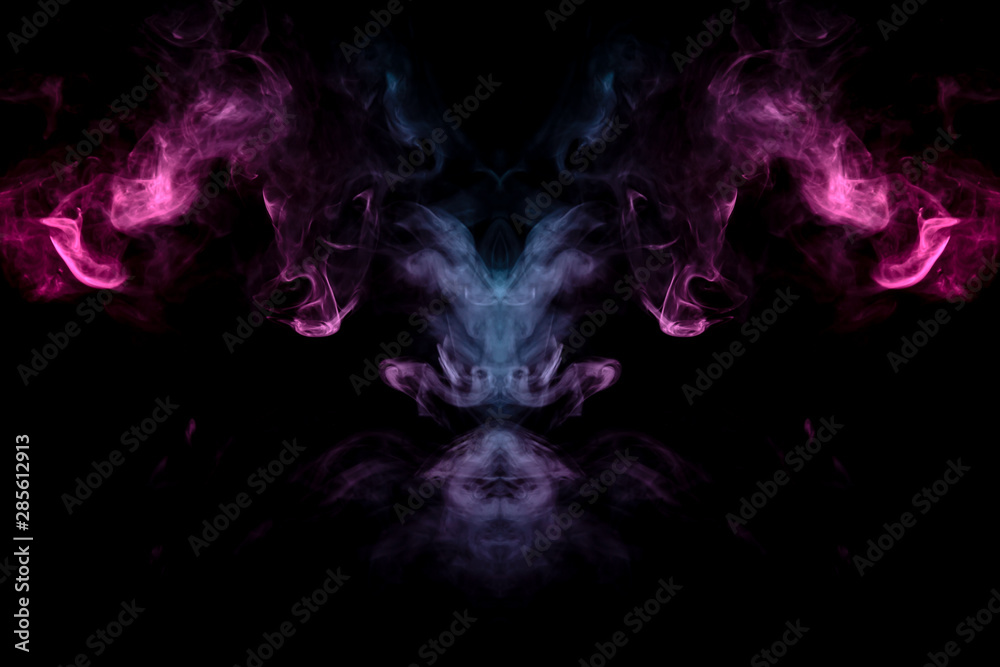 Smoke of different blue, red and pink colors in form of horror in the shape of the head, face and eye with wings on a black isolated background. Soul and ghost in mystical symbol. Print for clothes. Smoke of different blue, red and pink colors in form of horror in the shape of the head, face and eye with wings on a black isolated background. Soul and ghost in mystical symbol. Print for clothes.