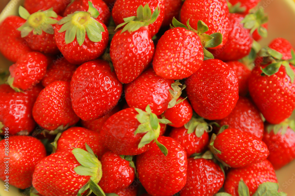 background from freshly harvested red strawberries background from freshly harvested red strawberries