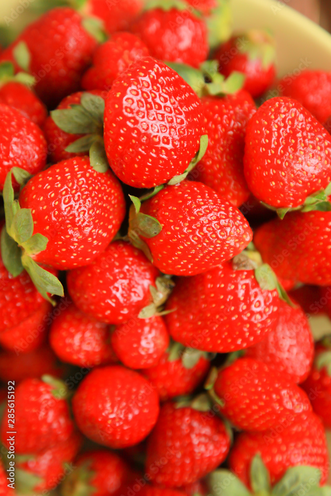 background from freshly harvested red strawberries background from freshly harvested red strawberries