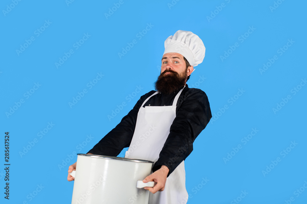 Male chef cook holds big pot. Cook man in apron holds saucepan in kitchen. Cookware, dinnerware, kitchenware. Cooking pot, saucepan, casserole. Cooking, culinary, food, profession and people concept. Male chef cook holds big pot. Cook man in apron holds saucepan in kitchen. Cookware, dinnerware, kitchenware. Cooking pot, saucepan, casserole. Cooking, culinary, food, profession and people concept.