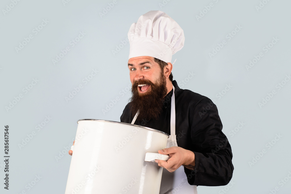 Cook man in apron holds saucepan in kitchen. Cooking pot, saucepan, casserole. Cooking, culinary, food, profession and people concept. Male chef cook holds big pot. Cookware, dinnerware, kitchenware. Cook man in apron holds saucepan in kitchen. Cooking pot, saucepan, casserole. Cooking, culinary, food, profession and people concept. Male chef cook holds big pot. Cookware, dinnerware, kitchenware.