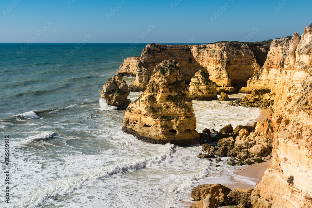 Stone formations at Albufeira, Portimao. Algarve, Atlantic ocean, Portugal. Rocky beaches with cliffs.