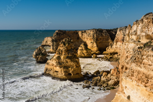 Stone formations at Albufeira, Portimao. Algarve, Atlantic ocean, Portugal. Rocky beaches with cliffs.