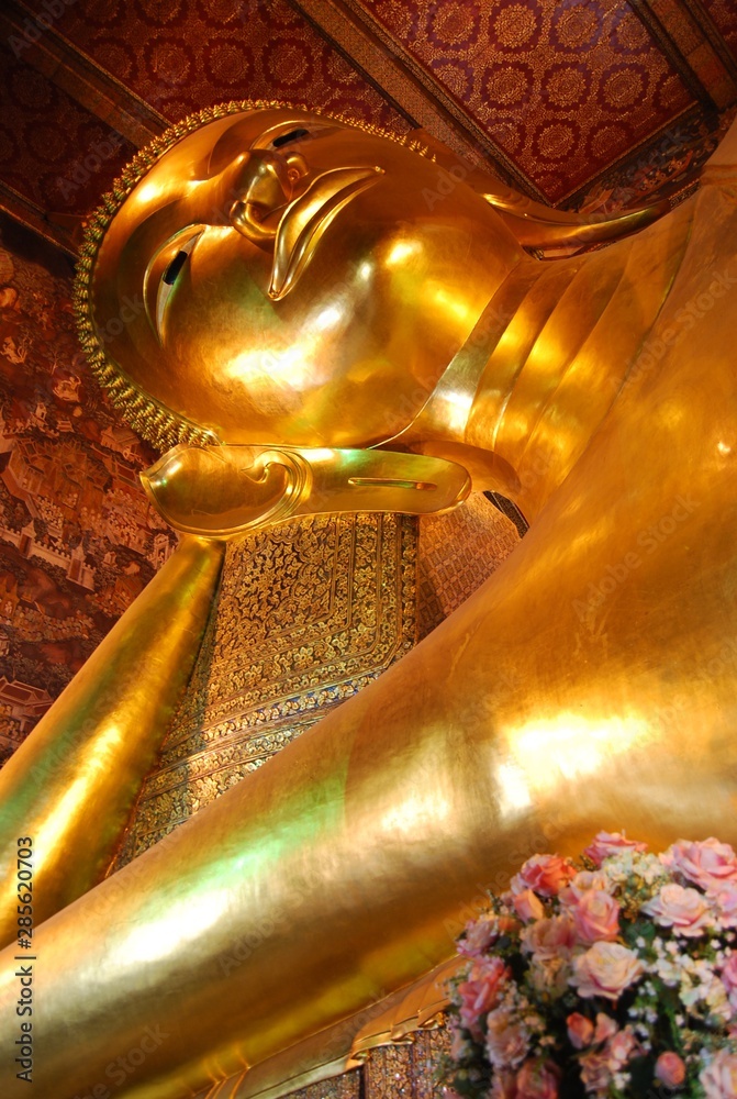 Reclining Buddha gold statue at Wat Pho, Bangkok, Thailand.
