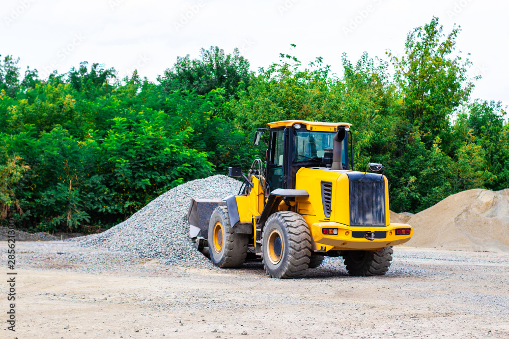 Unload bulk cargo with of the cargo railway platform in the mining quarry