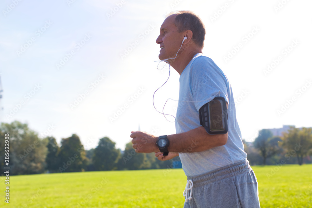 Active senior man running in park