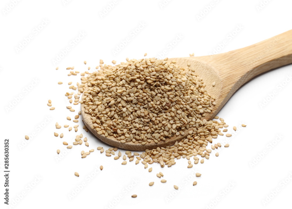 Organic integral sesame seeds with wooden spoon isolated on white background Organic integral sesame seeds with wooden spoon isolated on white background