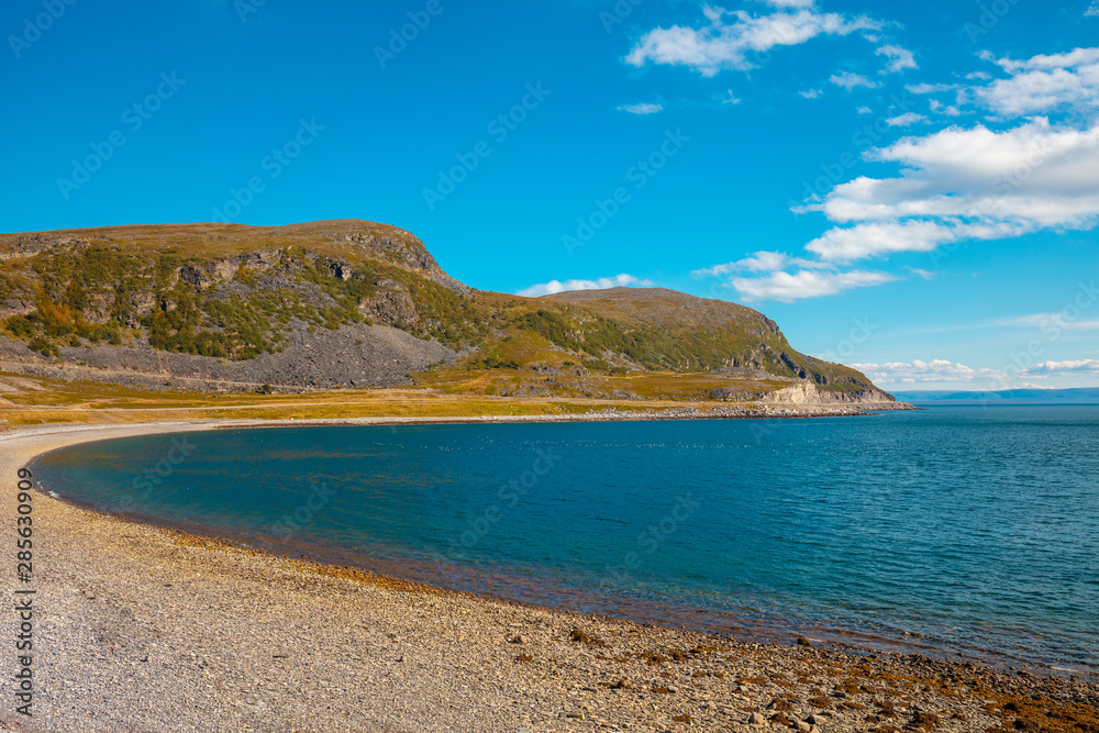 Rocky seashore. Wilderness. Beautiful nature of Norway. Open sea on a sunny day. Scandinavian nature landscape