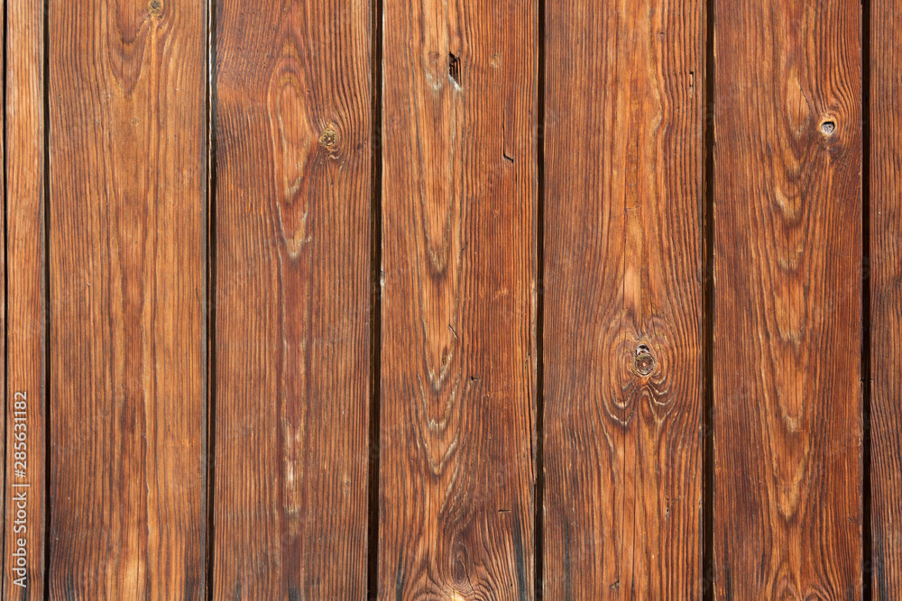 Brown wooden background from old yellow black planks Brown wooden background from old yellow black planks