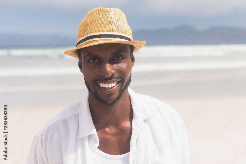 Man standing at beach on a sunny day