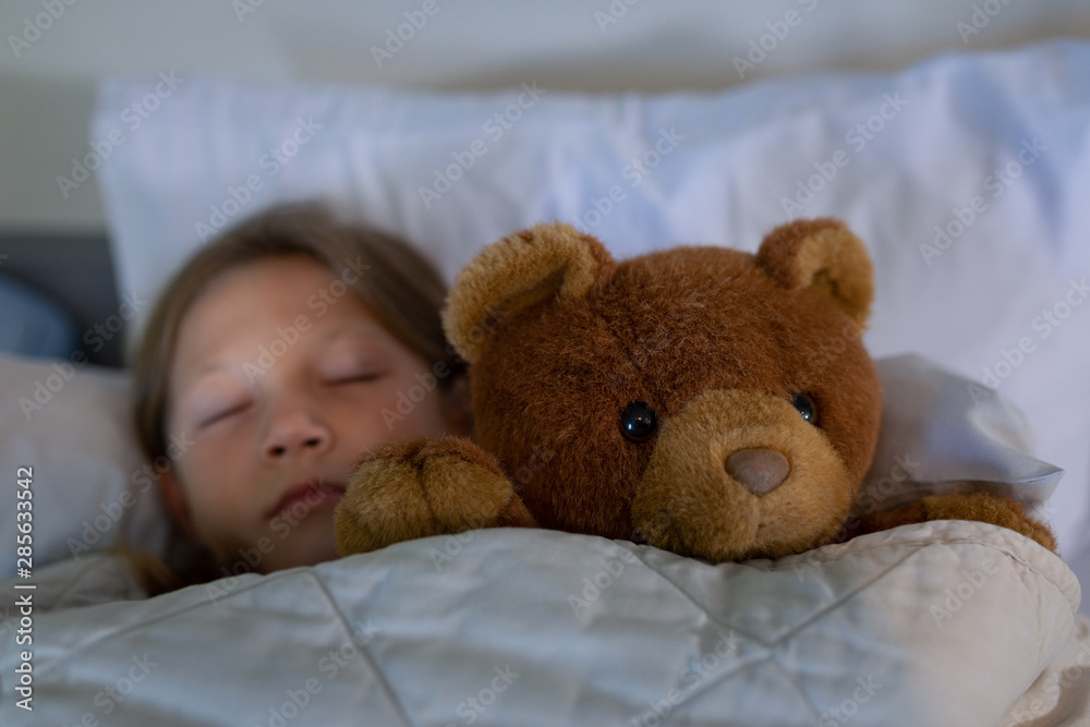 Girl patient sleeping on bed at hospital 