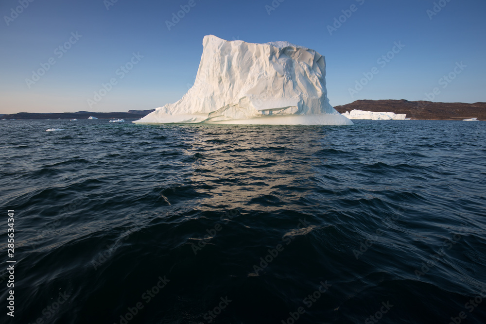 Huge icebergs of different forms in the Disko Bay, West Greenland. Their source is by the Jakobshavn glacier. This is a consequence of the phenomenon of global warming and catastrophic thawing of ice Huge icebergs of different forms in the Disko Bay, West Greenland. Their source is by the Jakobshavn glacier. This is a consequence of the phenomenon of global warming and catastrophic thawing of ice