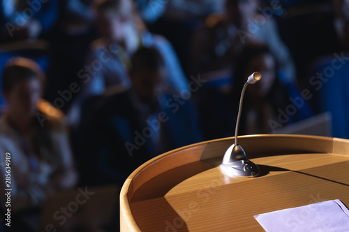 Canvas Print Podium with speaker in auditorium
