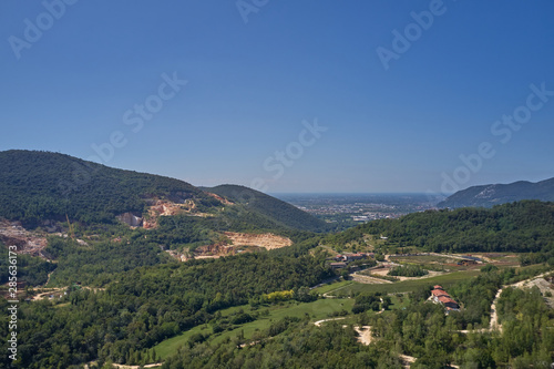 Air view of a marble quarry. Panoramic view of the extraction of marble in the quarry. Technique in the marble quarry of Brescia, Italy. Open pit mine.