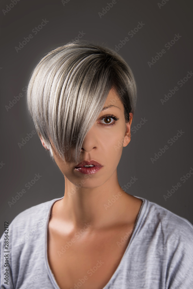 Short hair style hair cut grey silver platinum hair color Stock Photo |  Adobe Stock