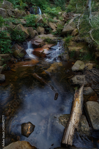 Flowing river between rocks in the forest