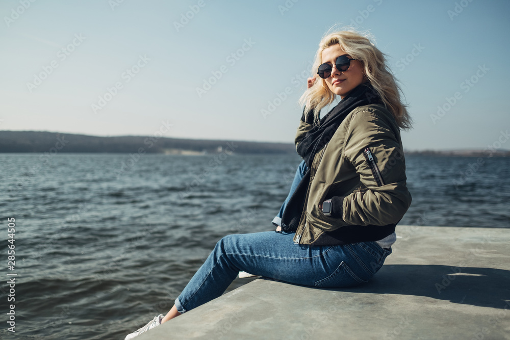 Beautiful Blonde Girl Having Fun Near the Lake