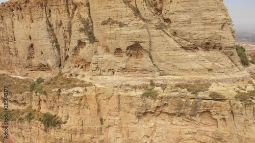 Rotating drone shot of historic rock-hewn church of Maryam Korkor in the Tigray region in Ethiopia photo