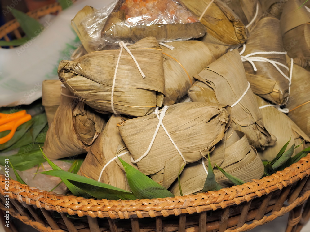 Many Bajangs in basket, delicious Chinese food made of sticky rice and various other ingredients which are all wrapped up in bamboo leaves and steamed.