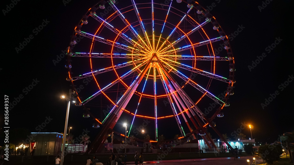 Ferris wheel an night in Batumi, Georgia. Promenade In Miracle Park, Amusement City Park in Night Time