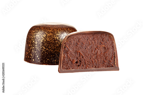 Cut luxury handmade bonbon with chocolate ganache filling isolated on white background