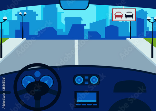 Car interior inside, steering wheel and dashboard, speedometer.