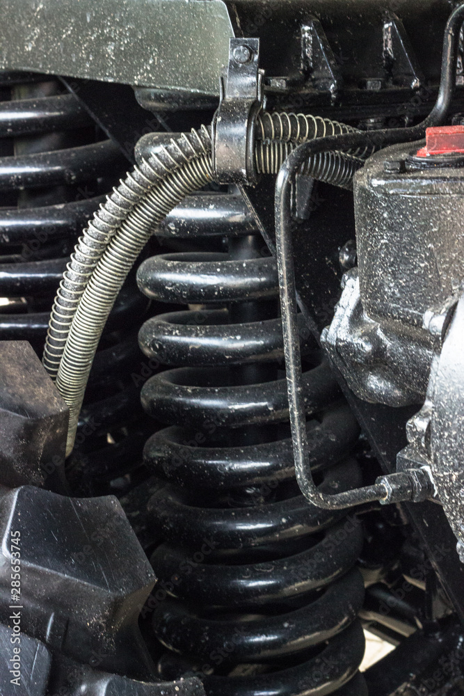 Suspension of a military truck. Close-up view Suspension of a military truck. Close-up view